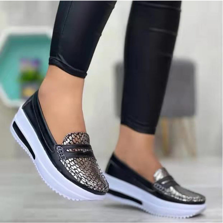 Women's comfortable Slip-On shoes with a stylish snake leather design and a cushioned sole Lune London