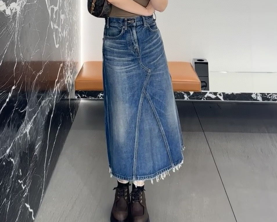 Women's maxi skirt in a casual denim style with asymmetrical hem and fringes Lune London