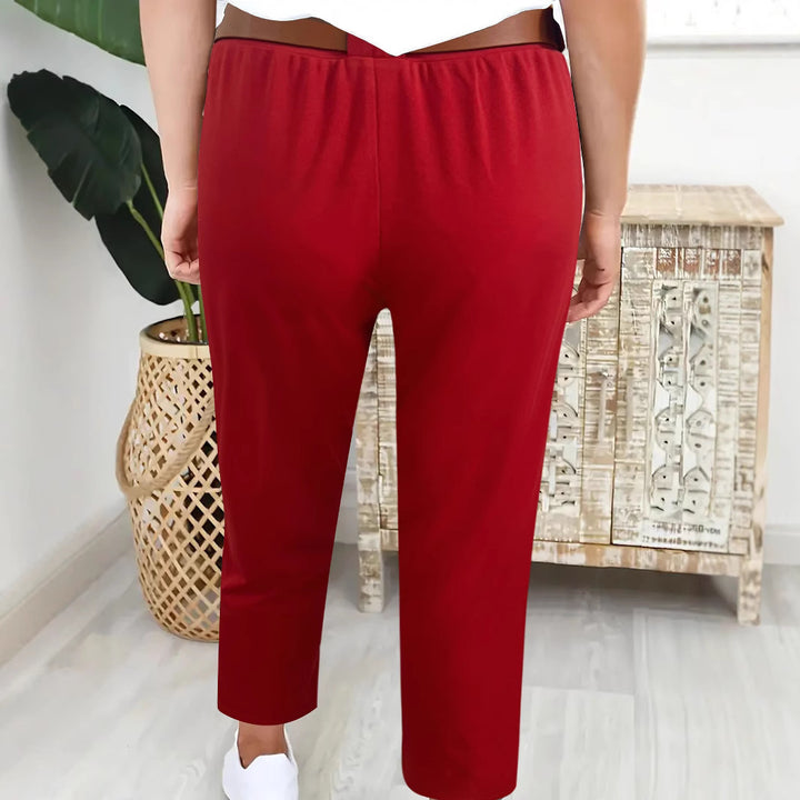 Elegant high-waisted pants for women with decorative pleats and practical pockets Lune London