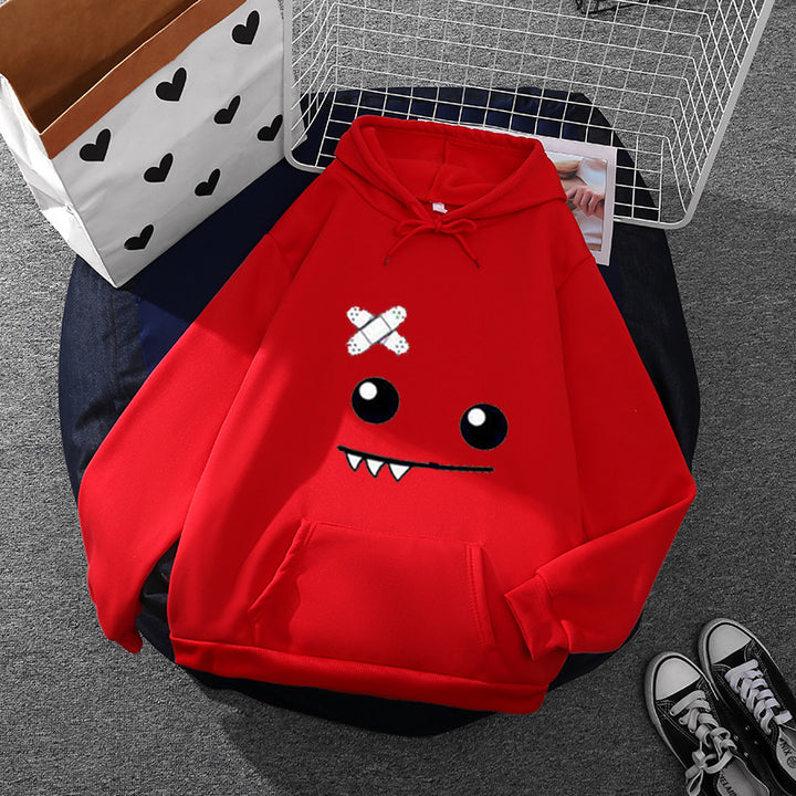 Women's hoodie with playful monster design Chic & Stil
