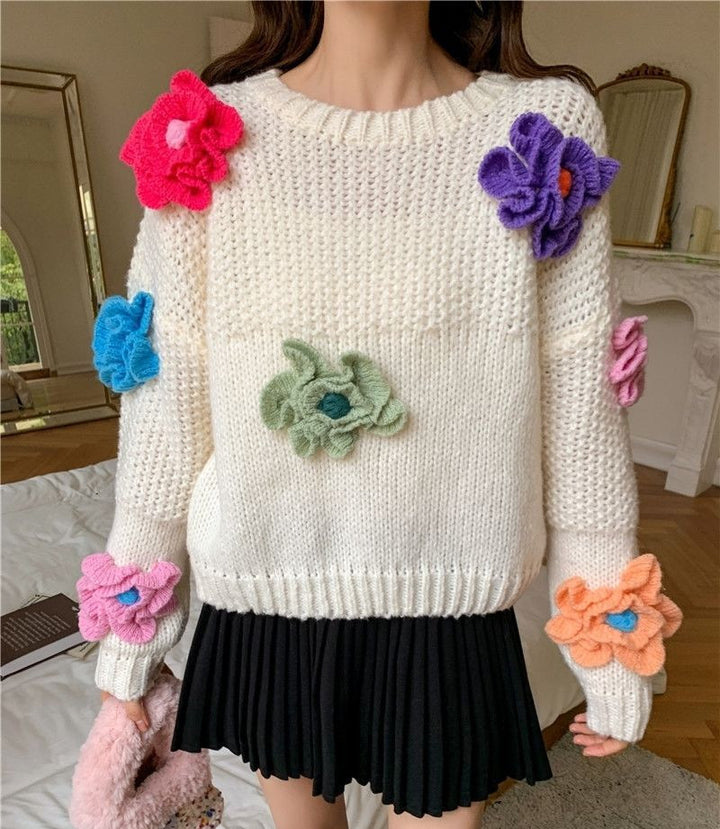 Women’s knitted sweater with chic floral appliqués and style