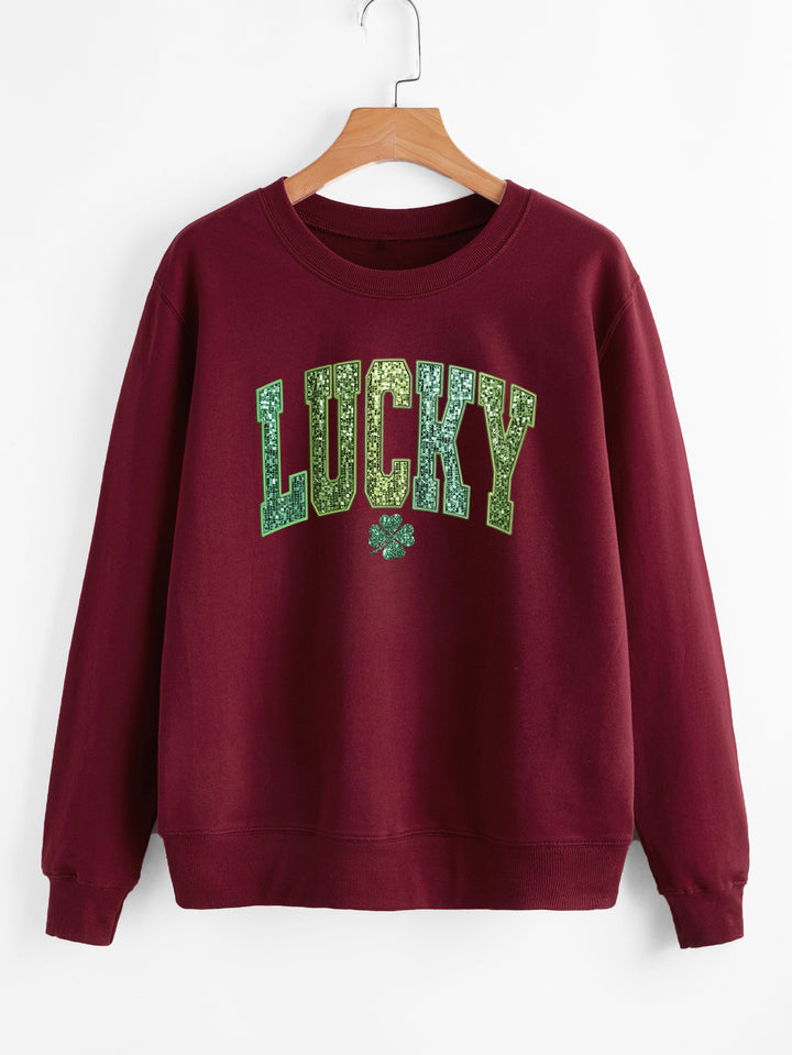 Sweatshirt décontracté pour femmes avec lettrage étincelant et motif de trèfle Chic & Stil