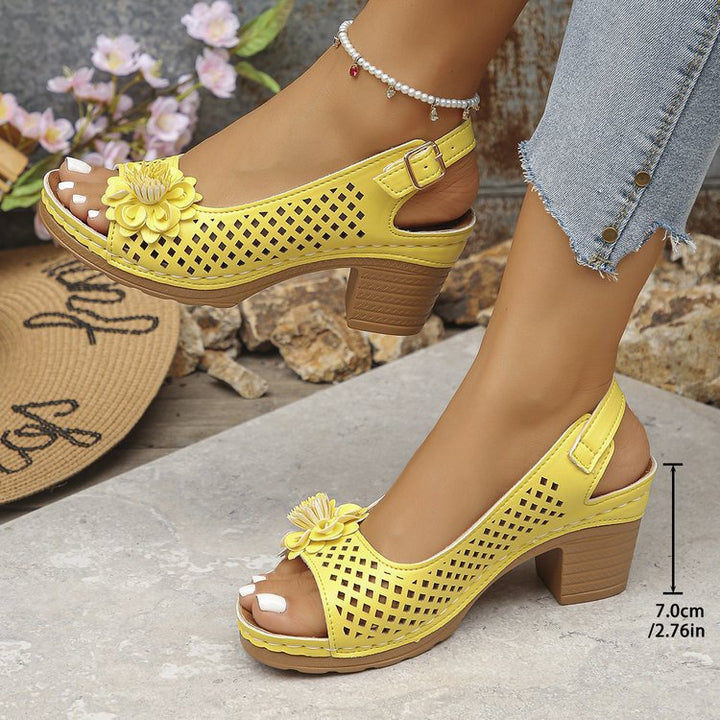 Women's clogs with a decorative floral detail and a perforated surface Lune London