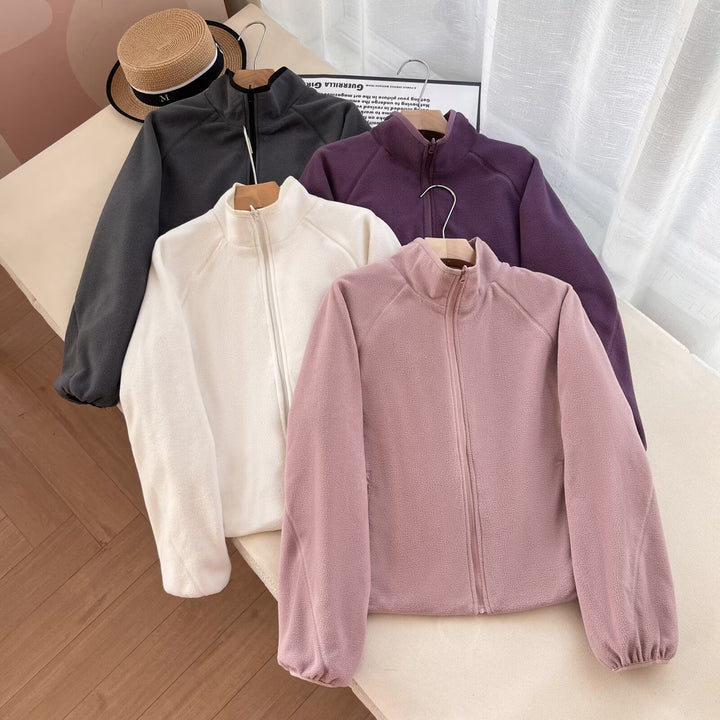 Veste en polaire confortable pour femmes avec col haut et poches pratiques Chic & Stil