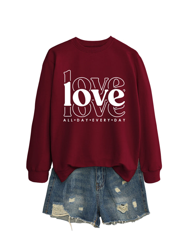 Sweat-shirt pour femmes avec des manches volumineuses et imprimé moderne "love" Chic & Stil