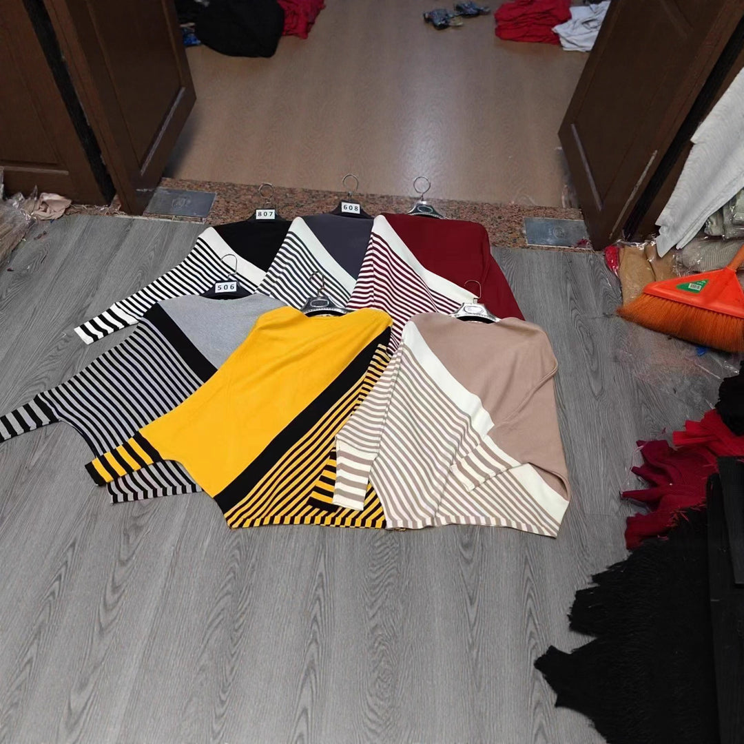Fashionable knitted sweater for women with asymmetrical cut and graphic striped pattern Lune London