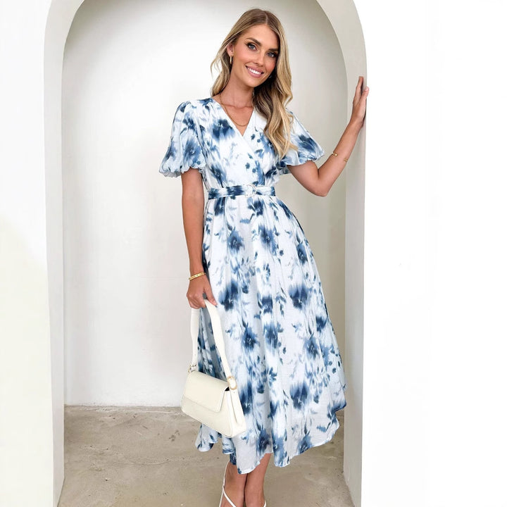 Midi dress for women with a playful wrap design and floral accents Chic & Stil