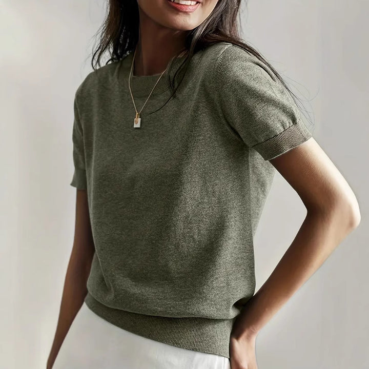 Fine knit sweater for women with a short sleeve silhouette and a soft fluid material Elegance and style