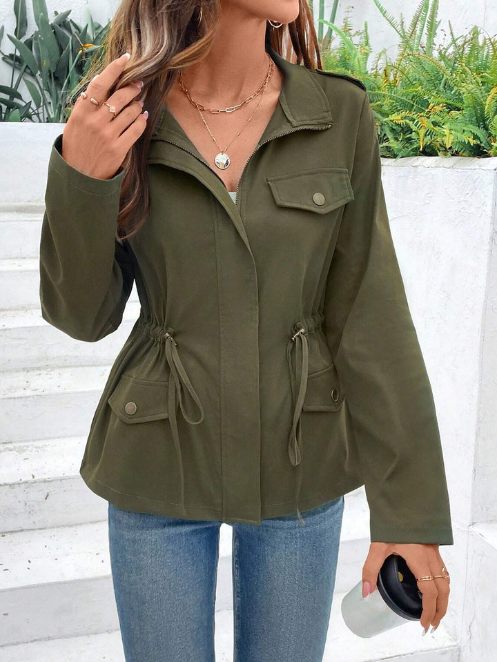 Women's transition jacket with practical pockets and adjustable drawstring.