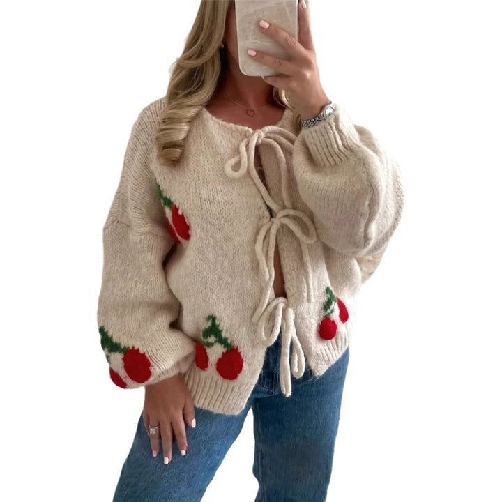 Women's knitted jacket with playful cherry pattern and decorative bows Lune London