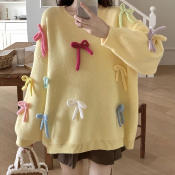 Casual sweater for women with playful bow appliqués Lune London