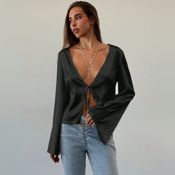 Blouse élégante femme avec décolleté en V profond et détail de nœud décontracté Chic & Stil