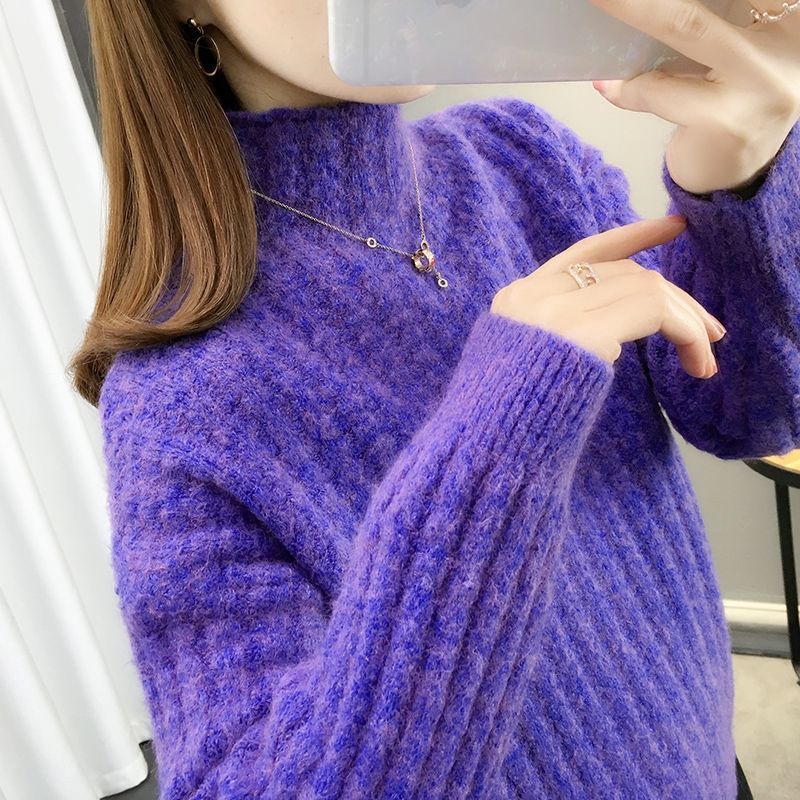 Knitted sweater for women with a modern ribbed design featuring a high collar and relaxed sleeves Lune London