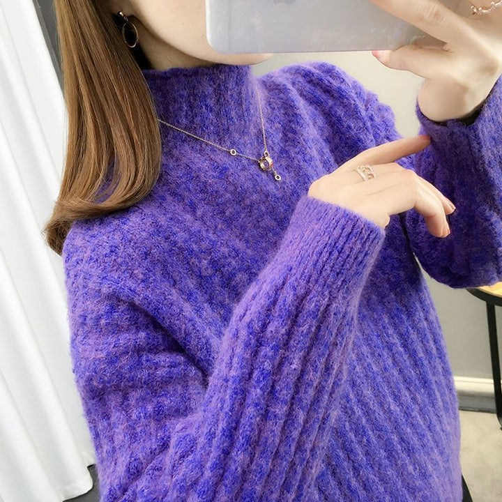 Knitted sweater for women with a modern ribbed design featuring a high collar and relaxed sleeves Lune London