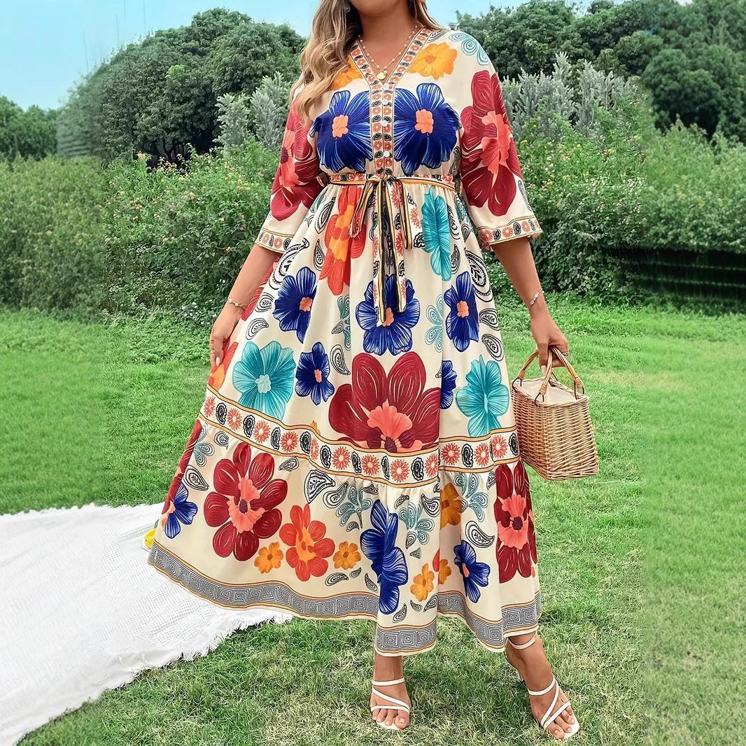 Women's maxi dress with colorful floral design and waist belt Lune London