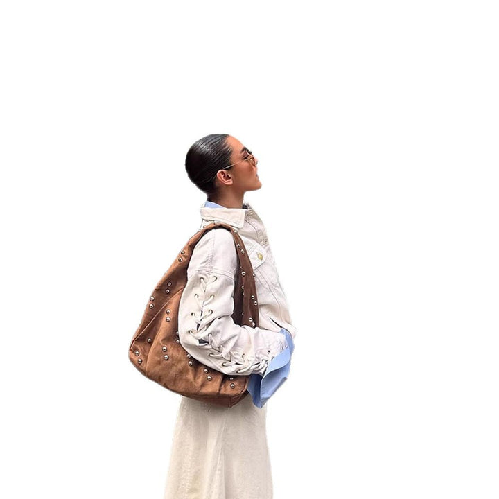 Designer handbag for women with decorative bead details and a unique cut Lune London