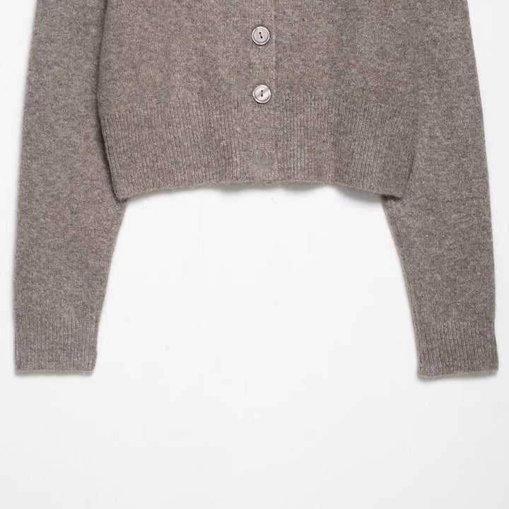 Short knitted jacket for women with an elegant round neck and button closure Lune London