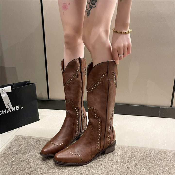 Ladies' cowboy boots with trendy stud accents and a comfortable block heel Lune London