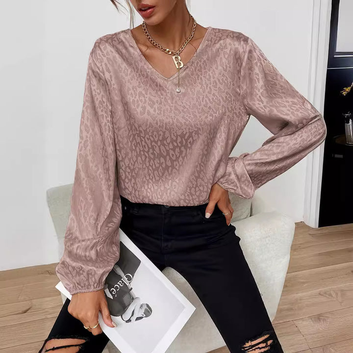 Blouse élégante pour femmes avec col en V et manches volumineuses Chic & Stil