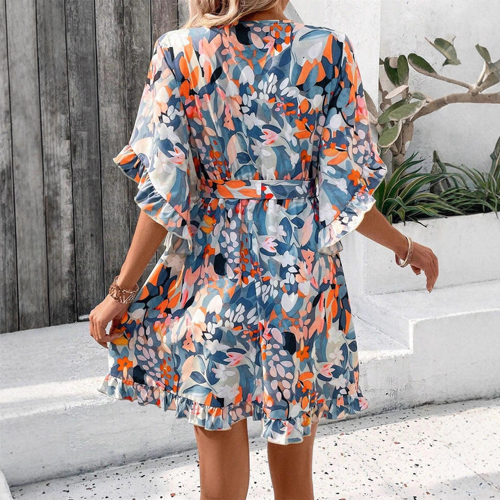 Wrap dress for women with ruffle details and a floral pattern Lune London