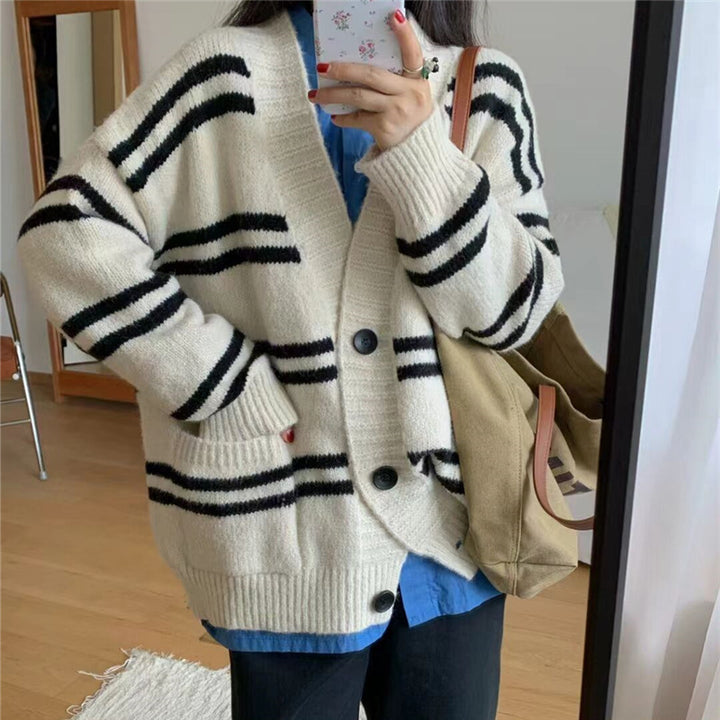 Chunky knit cardigan for women with wide lapels and decorative button details Lune London