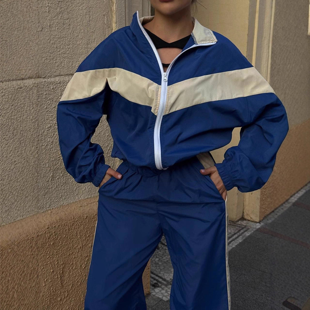 Women's sporty windbreaker with high collar and contrasting stripes Chic & Stil