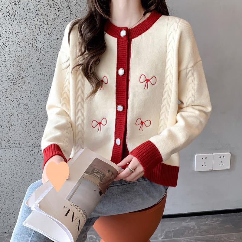 Ladies comfortable knitted cardigan with bow appliqués and a cable pattern Lune London