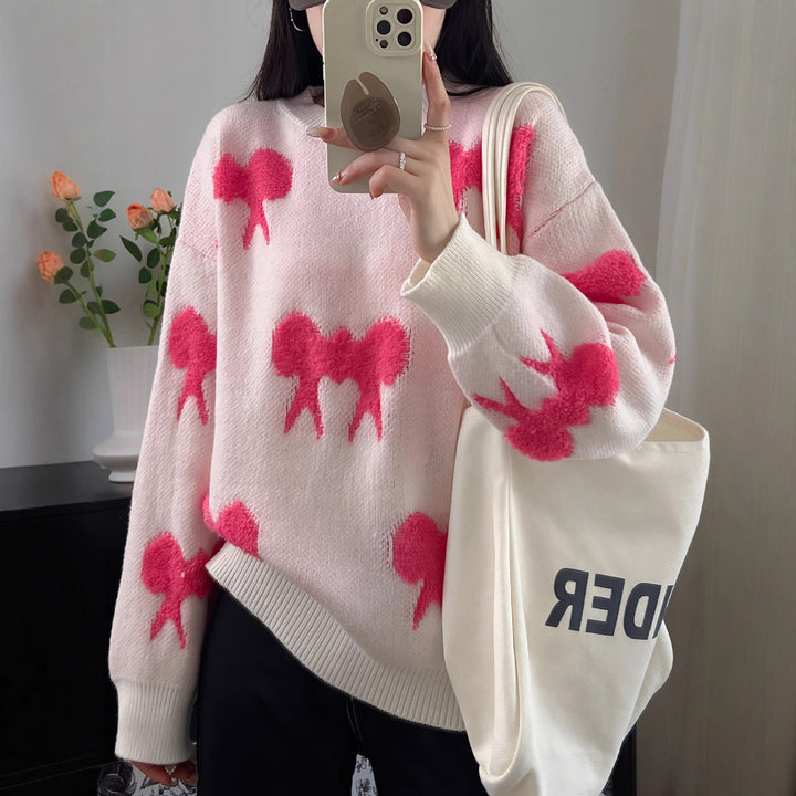 Cozy knitted sweater for women with playful bow pattern Lune London