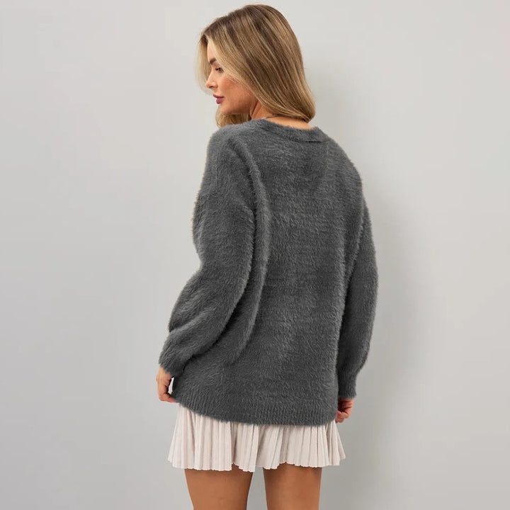 Cardigan confortable pour femmes avec coupe asymétrique et fermeture par bouton Chic & Stil