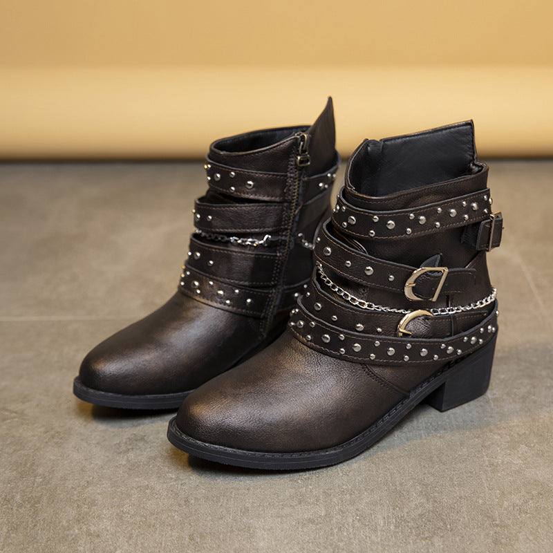 Trendy women's ankle boots with decorative straps and chain elements Lune London