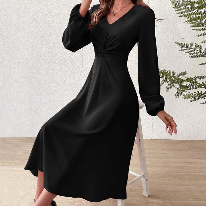 Elegant midi dress for women with a flattering drape and a deep V-neck Chic & Stil