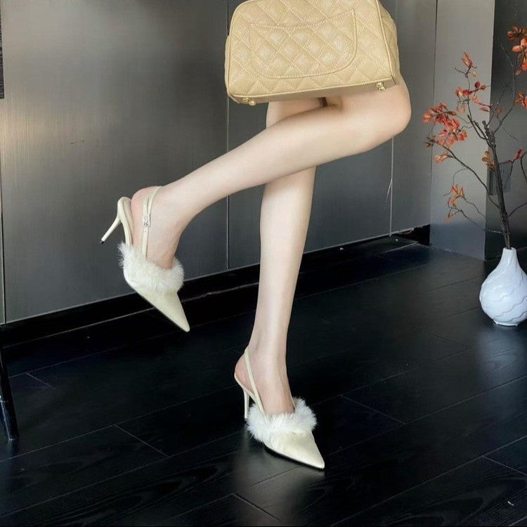 Slingback heeled pumps for ladies with a luxurious fur coating and a chic pointed design.