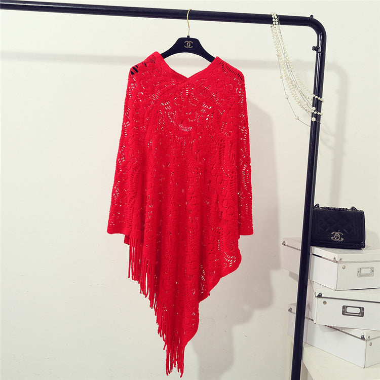 Knit poncho for women with an eye-catching crochet pattern and fashionable fringes Lune London
