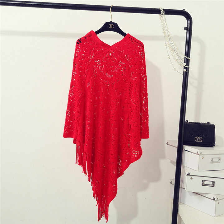 Knit poncho for women with an eye-catching crochet pattern and fashionable fringes Lune London