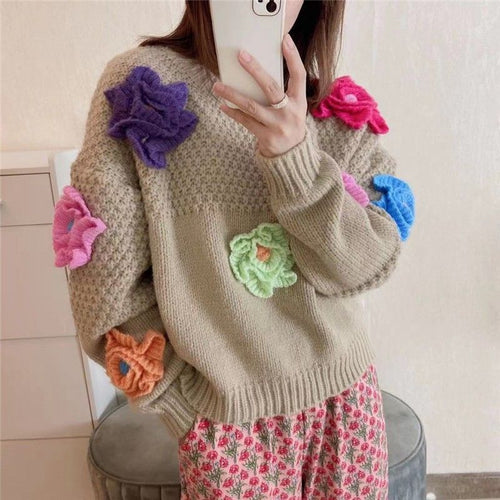 Women’s knitted sweater with chic floral appliqués and style
