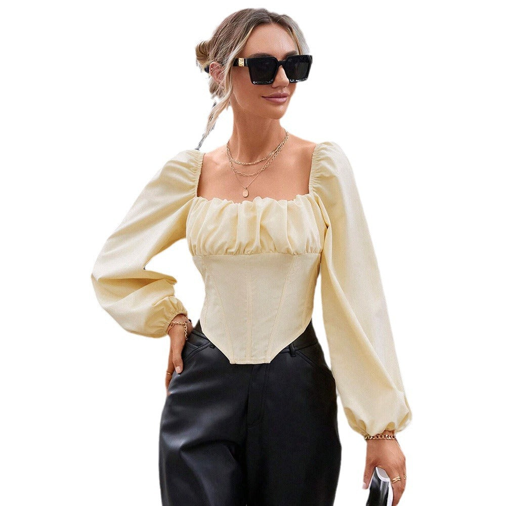 Blouse en dentelle pour femmes avec manches bouffantes et silhouette cintrée Chic & Stil