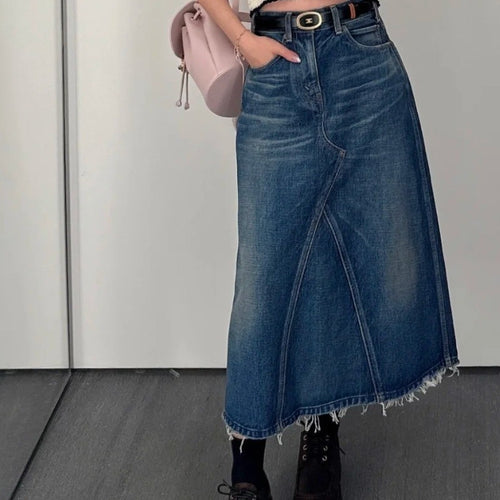 Women's maxi skirt in a casual denim style with asymmetrical hem and fringes Lune London