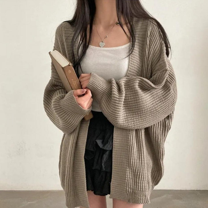 Plus size knitted jacket for women with wide sleeves and a structured texture Lune London