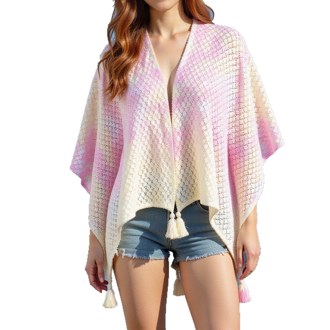 Airy knitted poncho for ladies with decorative fringes Lune London