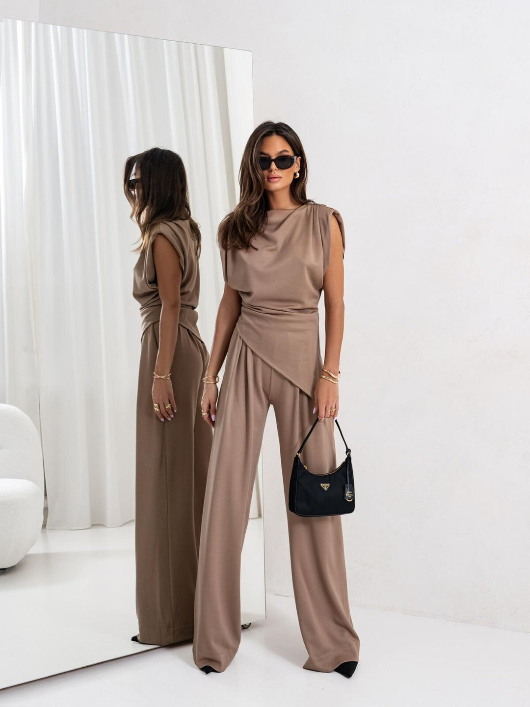 Elegantly tailored women's jumpsuit with an asymmetrical design and wide leg Lune London