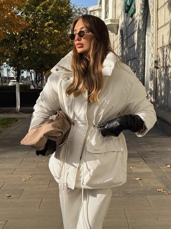 Quilted winter jacket for women with high collar and practical drawstring waist Lune London