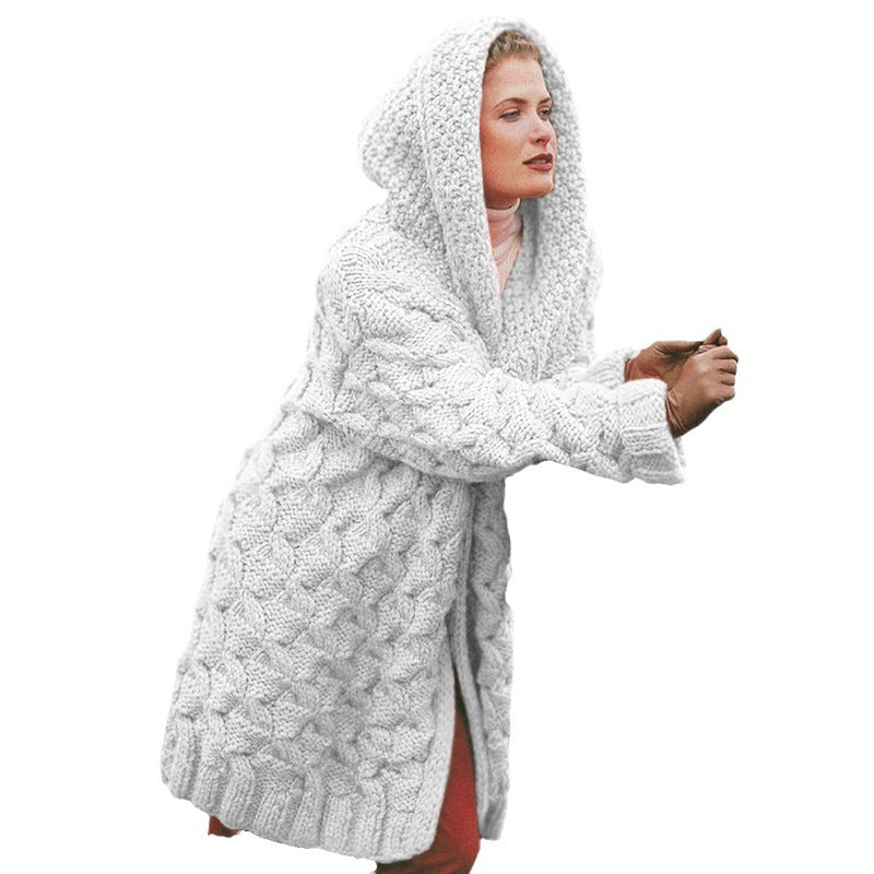Thick knitted coat for women with hood and decorative cable knit pattern Lune London