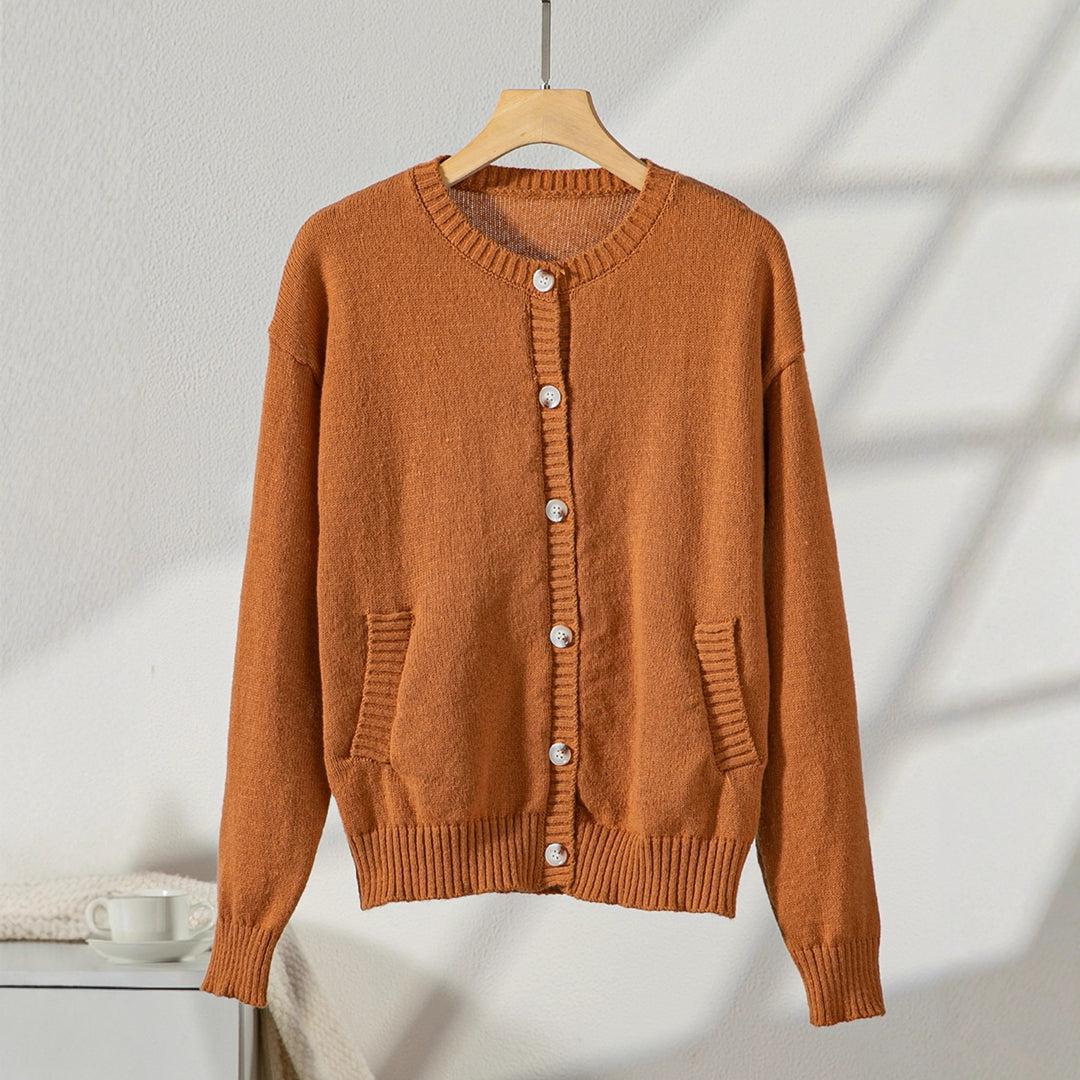 Elegant ladies cardigan with button details and practical pockets Lune London