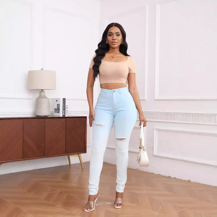 High-waisted women's fitted jeans with stylish ripped details Lune London