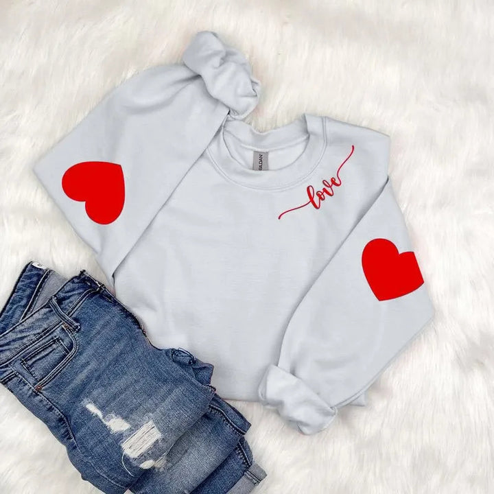 Sweatshirt femme avec design cœur et coupe décontractée Chic & Stil