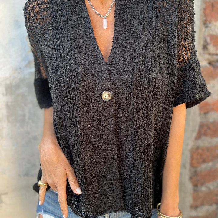 Knit blouse for women with modern openwork patterns and an elegant button front Lune London