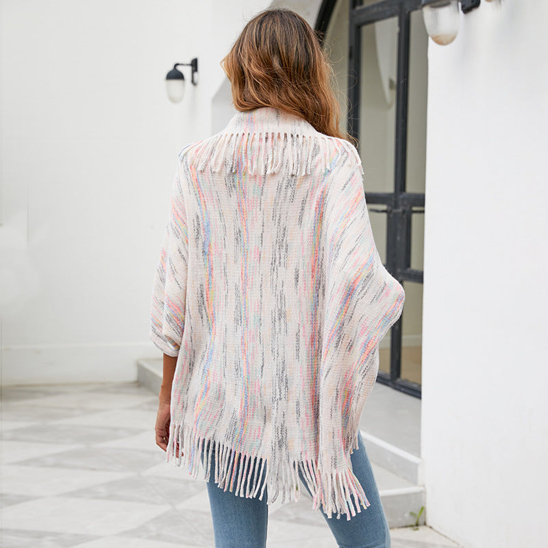 Ladies knitted poncho with luxurious fringes and a modern design Lune London