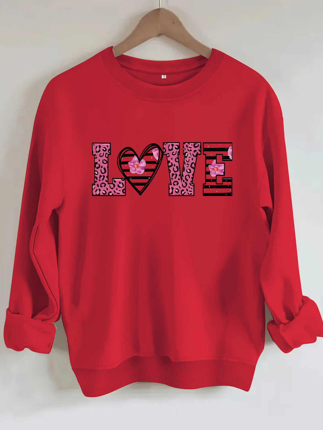 Sweatshirt femme avec design moderne de cœur léopard et coupe confortable Chic & Stil