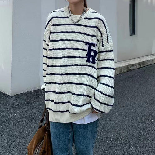 Casual oversized knit sweater for women with broken stripes and a chest pocket Lune London