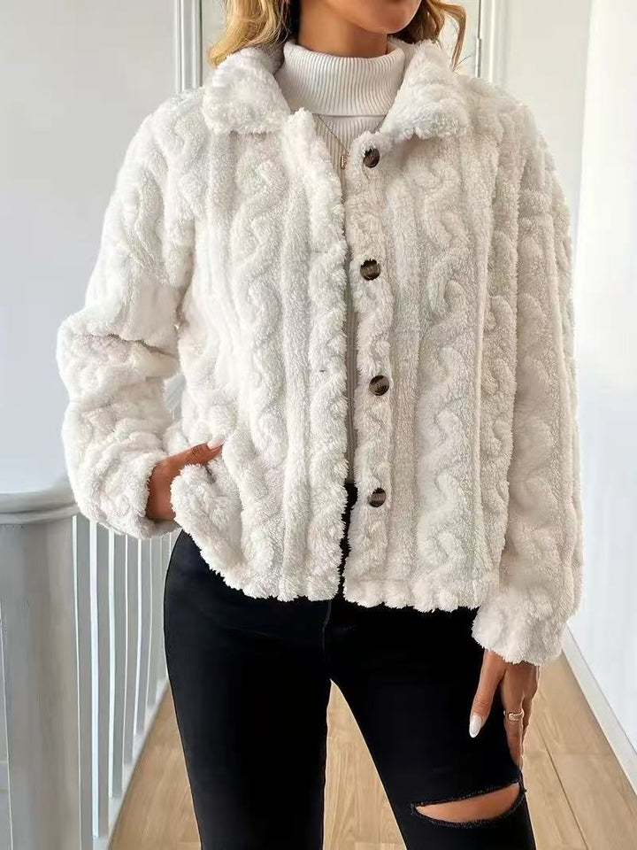 Women’s plush jacket with button closure and striped design.